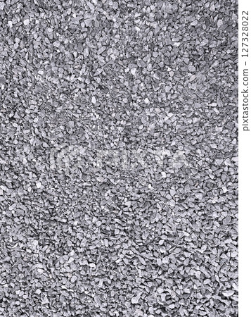 A vertical stock image of many small gray crushed stones laid out A vertical stock image of many small gray crushed stones laid out 127328022