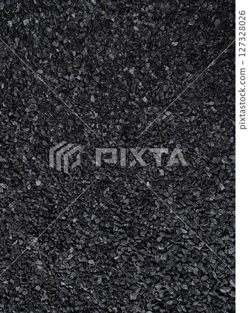圖像材料由許多小的深炭灰色垂直細長的碎石組成 127328026
