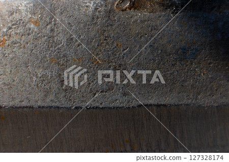 Rusty metal texture for background. Macro shot of stainless steel knife opening with rust Rusty metal texture for background. Macro shot of stainless steel knife opening with rust 127328174