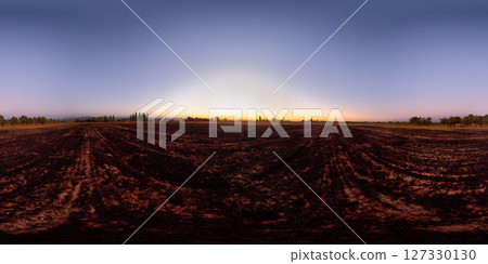 Spherical HDRi panorama of a burnt agricultural field at dusk in autumn. 127330130