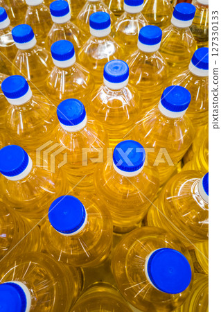 stack of bottles with sunflower seed oil 127330133