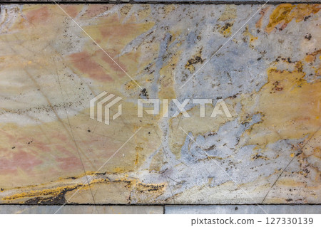 Worn Marble Floor Tiles with Earthy Tones and Dark Spots Worn Marble Floor Tiles with Earthy Tones and Dark Spots 127330139