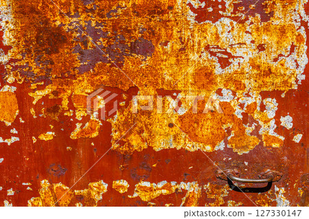 Flaking Red Paint on Rusty Metal 127330147