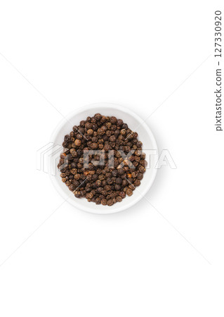 Black peppercorn in white bowl isolated Black peppercorn in white bowl isolated 127330920