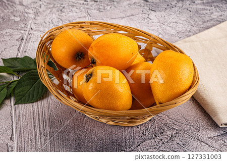 Ripe sweet juicy medlar fruit 127331003