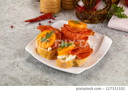 Bruschetta with sausage and tomato 127331102