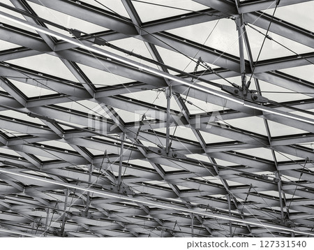 A close view of a geometric ceiling design showcasing metal framework 127331540