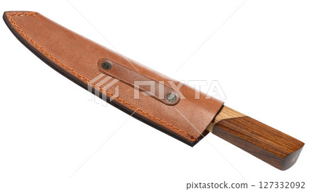 Knife with a wooden handle is inserted into a brown leather case Knife with a wooden handle is inserted into a brown leather case 127332092