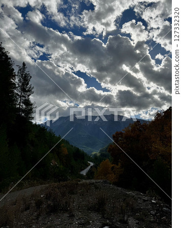 Mountainous road sky. Cloudy road landscape. High quality photo 127332320