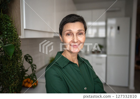 Smiling mature woman portrait. Happy relaxed female look at camera, natural beauty self acceptance Smiling mature woman portrait. Happy relaxed female look at camera, natural beauty self acceptance 127332810