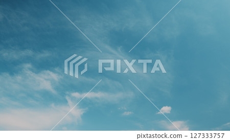 Time lapse. A Beautiful Clear Sky Displaying Wispy Clouds in a Peaceful Atmosphere Perfect for Daydreaming 127333757