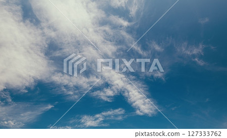 Time lapse. Beautiful and Majestic Cloud Patterns Gracefully Adorning a Clear Bright Blue Sky 127333762