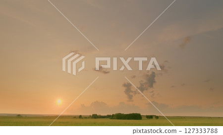 Time lapse. A Serene Sunrise Unfolds Over a Beautifully Tranquil Landscape, Capturing Peaceful Moments 127333788