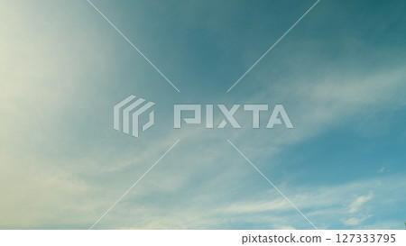 Time lapse. A Serene Blue Sky with Soft Clouds that Creates a Tranquil and Peaceful Atmosphere Time lapse. A Serene Blue Sky with Soft Clouds that Creates a Tranquil and Peaceful Atmosphere 127333795
