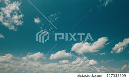 Time lapse. A Beautiful Serene Blue Sky Filled with Fluffy White Clouds An Absolutely Perfect Day 127333809