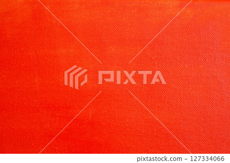 Painting canvas painted with red acrylic paint. Red canvas texture. 127334066