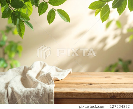 Wooden table and linen with natural light Wooden table and linen with natural light 127334852