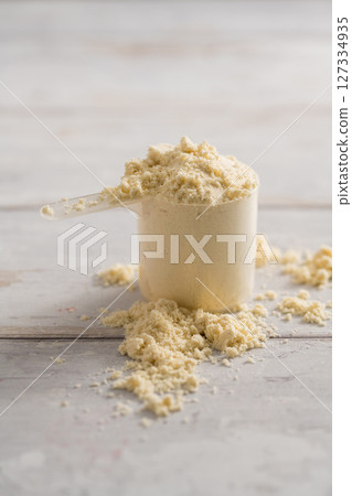 Protein powder scoop. Food beauty and health supplement closeup 127334935
