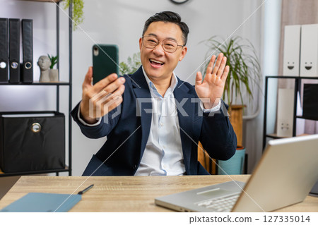 Business office man blogger influencer making phone conversation mobile call social media followers 127335014