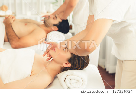 Caucasian couple enjoying relaxing anti-stress head massage. Quiescent Caucasian couple enjoying relaxing anti-stress head massage. Quiescent 127336724