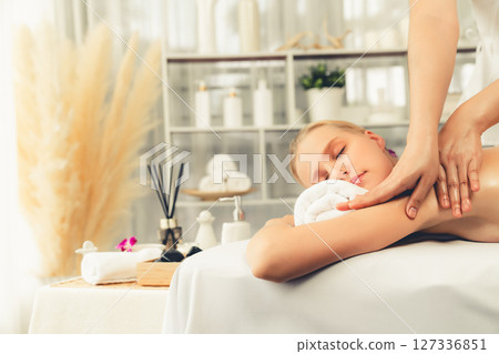 Caucasian woman customer enjoying relaxing anti-stress massage. Quiescent 127336851