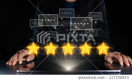 Hands of a person interacting with digital elements representing customer feedback, ratings, and communication in a modern setting. Qubit 127336853