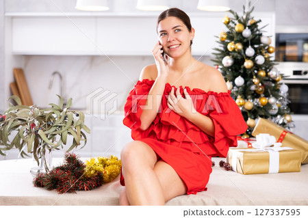Talking on phone, girl shares plans for New Year 127337595