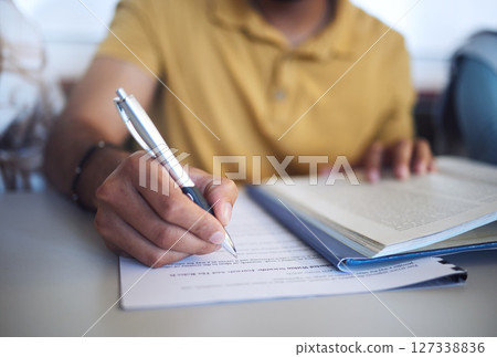 Student exam, college test and hand of man writing question paper in classroom for education, book research and knowledge for scholarship registration. Person at university to study, learn and write Student exam, college test and hand of man writing question paper in classroom for education, book research and knowledge for scholarship registration. Person at university to study, learn and write 127338836