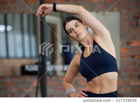 Exercise, woman and stretching for fitness, competition and workout for wellness, health and body care. Female athlete, bodybuilder and healthy girl in gym, start training and flexibility for sports Exercise, woman and stretching for fitness, competition and workout for wellness, health and body care. Female athlete, bodybuilder and healthy girl in gym, start training and flexibility for sports 127339038