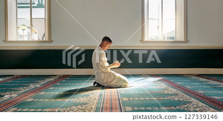 Muslim pray, hope or hands in prayer on carpet for peace, gratitude or support to Allah in holy temple or mosque. Trust, Islamic or spiritual person praying to worship God on Ramadan Kareem in Qatar Muslim pray, hope or hands in prayer on carpet for peace, gratitude or support to Allah in holy temple or mosque. Trust, Islamic or spiritual person praying to worship God on Ramadan Kareem in Qatar 127339146