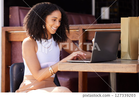 Woman, cafe and laptop with smile, shopping and ecommerce on internet sale, discount or deal. Black woman, happy and coffee shop with online shopping, computer and web to search, clothes and fashion Woman, cafe and laptop with smile, shopping and ecommerce on internet sale, discount or deal. Black woman, happy and coffee shop with online shopping, computer and web to search, clothes and fashion 127339203