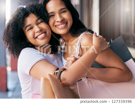 Happy, friends and hug portrait with shopping bag products for boutique purchase fun in New York, USA. Smile, care and appreciation in women friendship with black people enjoying shopping spree. 127339396