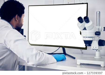 African scientist man, green screen and computer in research, reading or focus for goals in lab. Black man, science or laboratory with blank desktop pc for vision, healthcare or pharmaceutical mockup 127339397