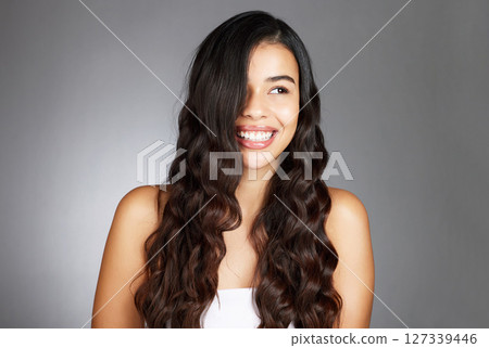 Hair care, woman and shine for beauty, natural glow and on grey studio background. Female, girl and hairstyle for wellness, confident and aesthetic for luxury grooming, treatment and salon routine. Hair care, woman and shine for beauty, natural glow and on grey studio background. Female, girl and hairstyle for wellness, confident and aesthetic for luxury grooming, treatment and salon routine. 127339446