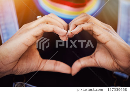 LGBTQ, pride and hands with a heart sign for love, equality and solidarity of a gay woman. Rainbow, freedom and closeup of lesbian female with a hand symbol at a gay pride celebration festival. 127339668