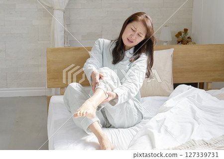 Middle-aged woman with cramps 127339731