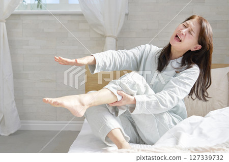 Middle-aged woman with cramps 127339732