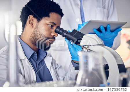 Black man, scientist and microscope with science research in laboratory, data analysis and expert with scientific or medical innovation. Phd doctor, face and biotechnology, chemistry and study in lab Black man, scientist and microscope with science research in laboratory, data analysis and expert with scientific or medical innovation. Phd doctor, face and biotechnology, chemistry and study in lab 127339762