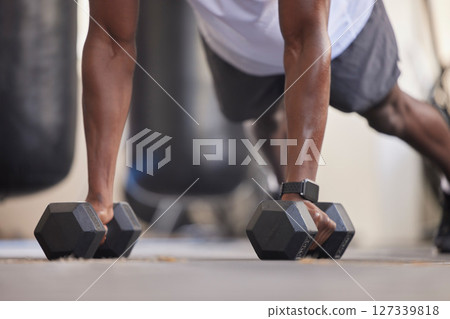 Weights, training and arms of a man in the gym, strong fitness and muscle building on the floor. Health, body and athlete strength training with a plank during a workout and exercise for health Weights, training and arms of a man in the gym, strong fitness and muscle building on the floor. Health, body and athlete strength training with a plank during a workout and exercise for health 127339818