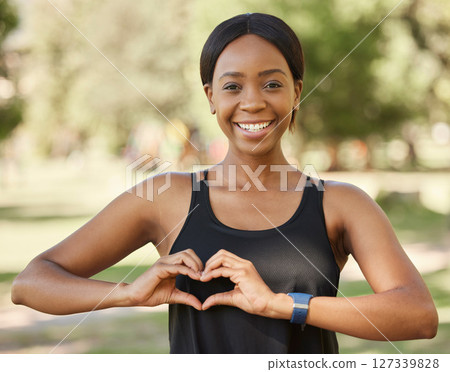Nature, fitness or black woman portrait with heart hand sign loves training, exercise, outdoor park workout in summer. Wellness, face or healthy girl with a calm, peaceful or happy smile in Nigeria Nature, fitness or black woman portrait with heart hand sign loves training, exercise, outdoor park workout in summer. Wellness, face or healthy girl with a calm, peaceful or happy smile in Nigeria 127339828