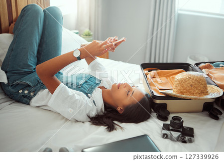 Travel communication, relax and woman with a phone on holiday for social media, mobile app and influencer update. Chat, internet and girl typing on a mobile during a hotel vacation for a blog Travel communication, relax and woman with a phone on holiday for social media, mobile app and influencer update. Chat, internet and girl typing on a mobile during a hotel vacation for a blog 127339926