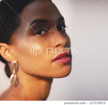 Portrait, beauty and skincare with a model black woman in studio on a gray background for natural care. Face, cosmetics and wellness with an attractive young female posing to promote a luxury product 127339959
