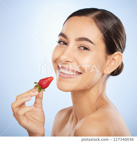 Beauty, strawberry and face with skincare, woman with glow and natural cosmetics with organic treatment and portrait. Fruit, healthy skin and wellness with nature product against studio background. Beauty, strawberry and face with skincare, woman with glow and natural cosmetics with organic treatment and portrait. Fruit, healthy skin and wellness with nature product against studio background. 127340036