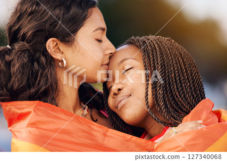 Hug, love and lgbtq couple with a flag for sexuality pride, relationship freedom and comfort with partner in city of New Zealand. Diversity, affection and gay lesbian women with freedom in community 127340068