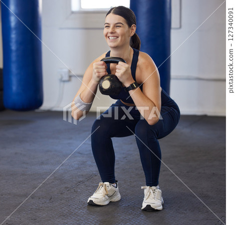 Fitness, exercise and woman doing weight lifting in gym for healthy lifestyle, wellness and cardio. Sports, kettlebell and girl for bodybuilder training for strong muscles, performance and workout 127340091