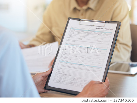 Health insurance, healthcare and medical aid information with clipboard and health data. Application form, healthcare paperwork with hands and personal info for medicine, admin and documents. Health insurance, healthcare and medical aid information with clipboard and health data. Application form, healthcare paperwork with hands and personal info for medicine, admin and documents. 127340100