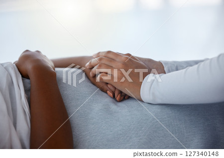 Empathy, support and hands of black family in hospital bed for sickness, virus and help. Comfort, hope and care with friends holding hands in healthcare clinic for surgery, medicine and compassion 127340148