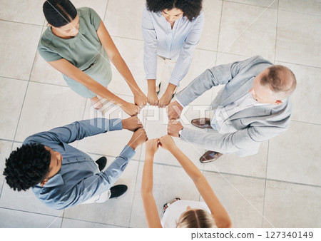 Above, business people and fist bump circle in office for teamwork, motivation and support for success. Corporate group, vision and team building in workplace with diversity, solidarity and mission Above, business people and fist bump circle in office for teamwork, motivation and support for success. Corporate group, vision and team building in workplace with diversity, solidarity and mission 127340149