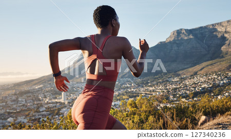 Back, black woman and running in nature, workout and training for wellness, health and fitness. African American female, trainer and runner outdoor, practice for marathon and exercise for cardio. 127340236