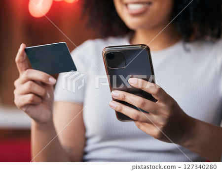 Woman hands, phone and credit card for ecommerce, online shopping and making payment on internet store or bills with fintech app. Female doing banking with secure smartphone network for savings Woman hands, phone and credit card for ecommerce, online shopping and making payment on internet store or bills with fintech app. Female doing banking with secure smartphone network for savings 127340280